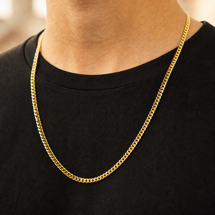 Slim Cuban chain shown on a model wearing a black shirt