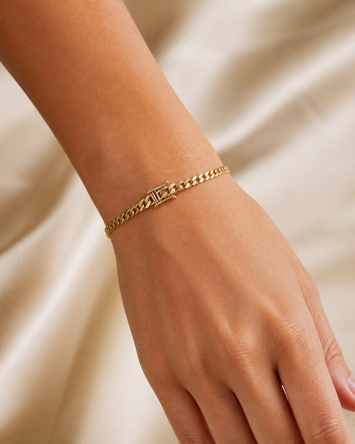 Slim Cuban bracelet on a woman's wrist