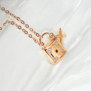 14k diamond lock necklace rose gold padlock pendant with floral detail and pave diamonds on delicate chain