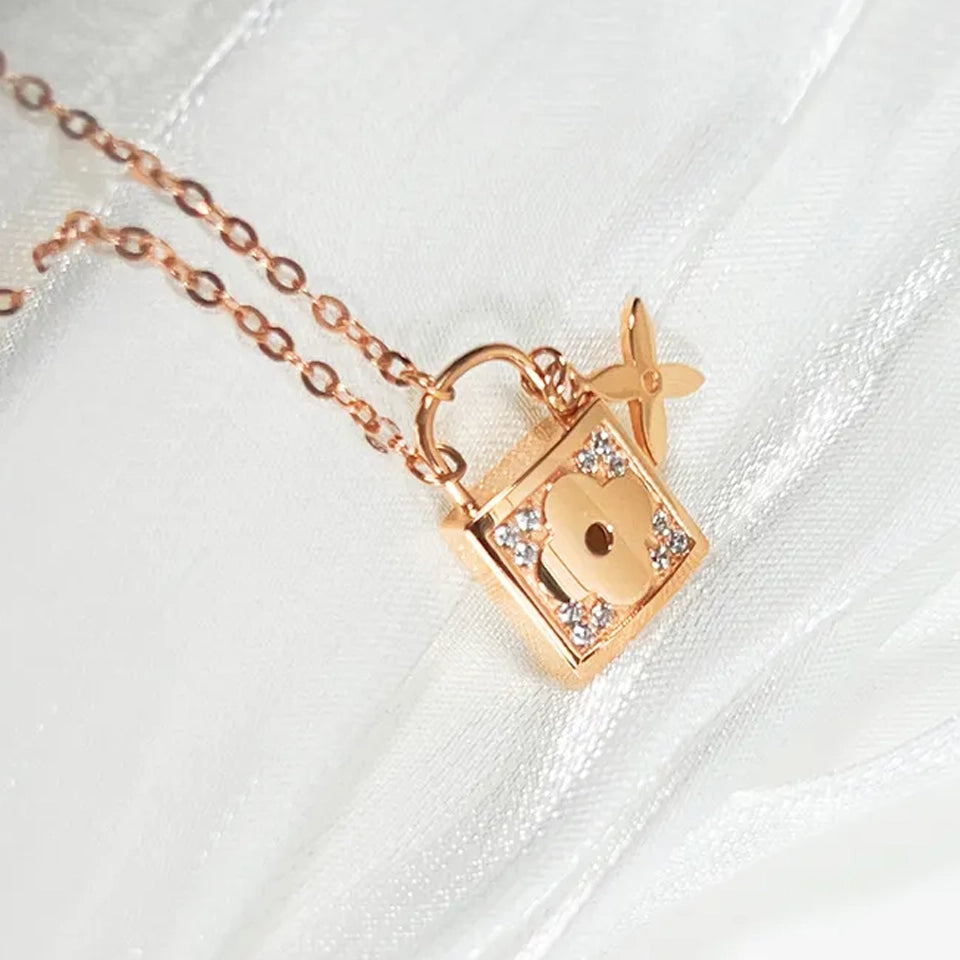 14k diamond lock necklace rose gold padlock pendant with floral detail and pave diamonds on delicate chain