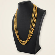 Three Cuban-chain sizing samples on a black display bust