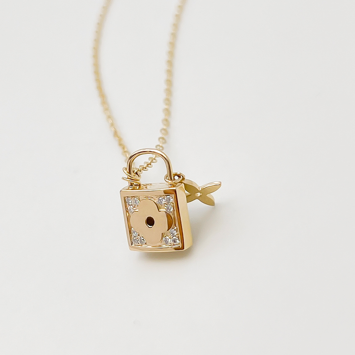 14k diamond lock necklace gold padlock pendant with corner diamonds on delicate chain for everyday wear