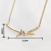 14K gold diamond knot necklace with curved bar pendant and pave diamonds on delicate chain