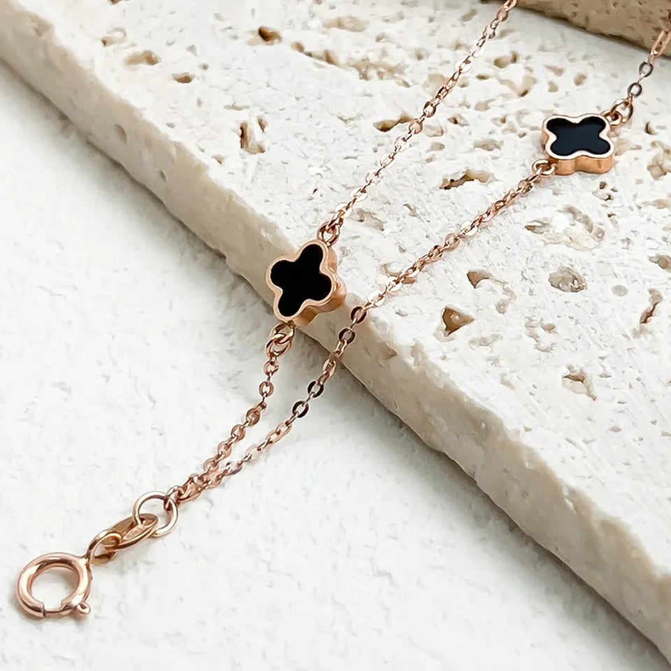 18K clover bracelet rose gold chain with black enamel clover charms and lobster clasp