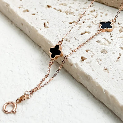18K clover bracelet rose gold chain with black enamel clover charms and lobster clasp