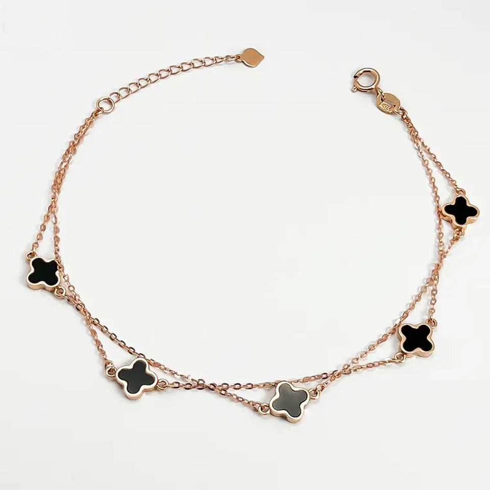 18K clover bracelet rose gold double chain with five black enamel clover charms adjustable lobster clasp