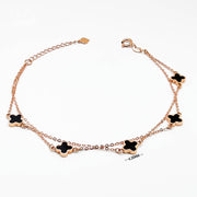 18K clover bracelet in rose gold double chain with five black enamel clover charms elegant dainty
