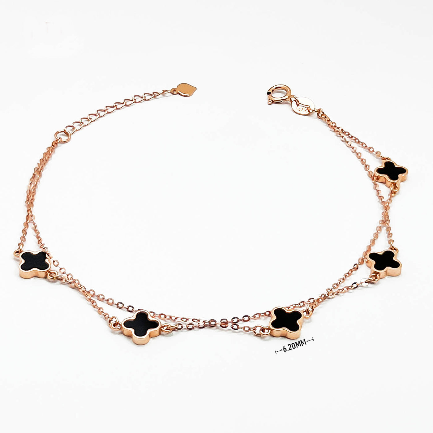 18K clover bracelet in rose gold double chain with five black enamel clover charms elegant dainty