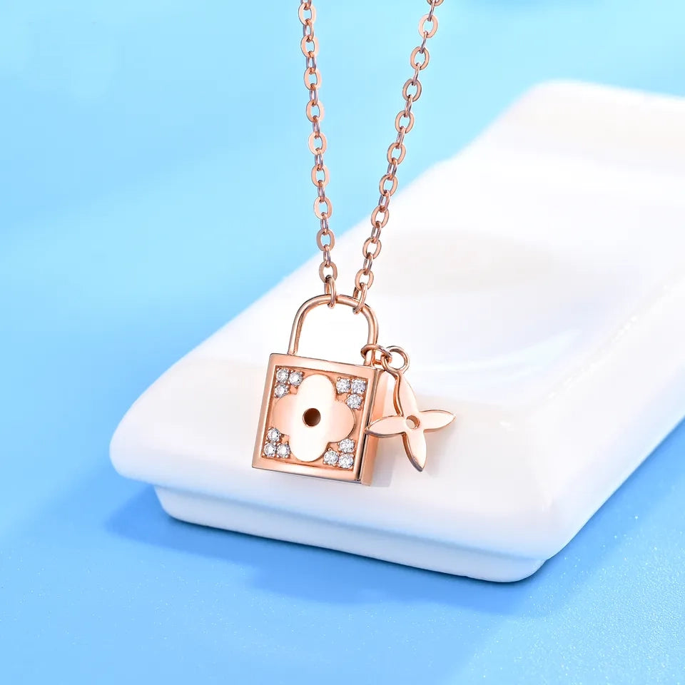 14k diamond lock necklace rose gold padlock pendant with floral motif and sparkling diamond accents on chain
