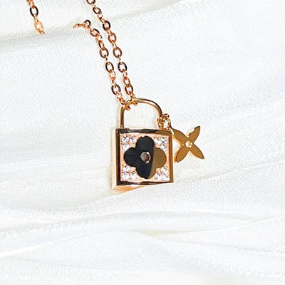 14k diamond lock necklace rose gold padlock pendant with black clover detail and flower charm