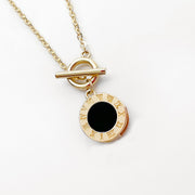 18K Roman clock necklace gold pendant with black enamel center and toggle clasp on delicate chain