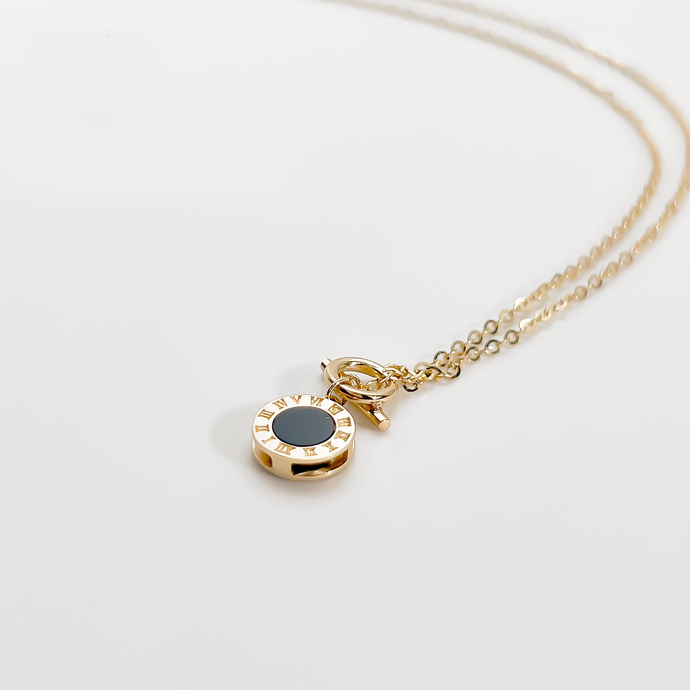 elegant 18K Roman clock necklace gold chain with round Roman numeral pendant and black enamel center