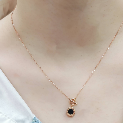18K Roman clock necklace rose gold chain with round black center pendant and front toggle clasp