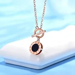 18K Roman clock necklace rose gold pendant with black enamel center and toggle chain
